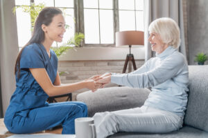 Female caregiver assisting a senior citizen